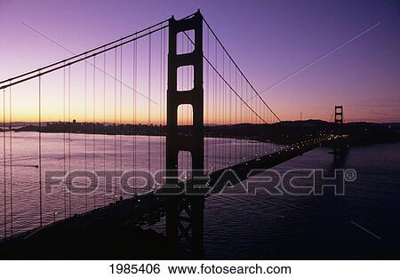 Stock Photograph - California, San Francisco, Golden Gate Bridge Silhouetted Against Evening Sky.. Fotosearch