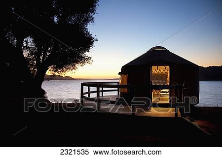 California, Santa Barbara County, A Yurt On Lake Cachuma Glows Just After Sunset. View Large Photo Image Stock Photography - California, Santa Barbara County, A Yurt On Lake Cachuma Glows Just After Sunset.. Fotosearch