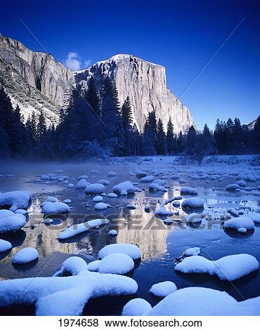 Stock Photo - California, Yosemite National Park, Yosemite Valley, Snowy Landscape Of El Capitan And Merced River.. Fotosearch