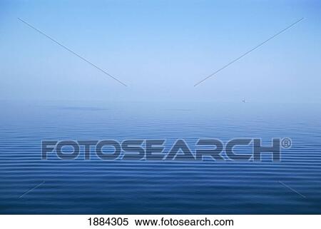 Stock Photography - Calm Blue Water Disappearing Into Horizon. Fotosearch