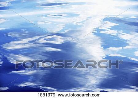 Calm Sea Surface With Reflections Of Clouds, Close Up View Large Photo Image Stock Photo - Calm Sea Surface With Reflections Of Clouds, Close Up. Fotosearch