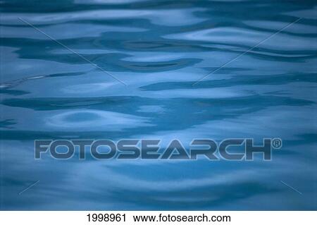 Stock Image - Calm, Tranquil, Turquoise Water Reflections B1472. Fotosearch