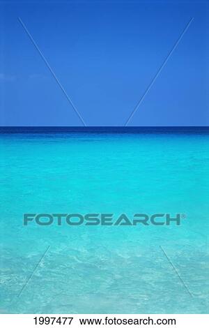 Stock Photo - Calm Turquoise Ocean Water To Horizon, Clear Blue Sky A33A. Fotosearch