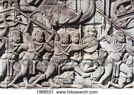 Cambodia, Angkor, Angkor Thom, Intricate Bas-Reliefs In The Bayon. View Large Photo Image Stock Image - Cambodia, Angkor, Angkor Thom, Intricate Bas-Reliefs In The Bayon.. Fotosearch