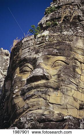 Cambodia, Angkor Thom, Close-up of stone face carving on south temple gate; Bayon View Large Photo Image Stock Image - Cambodia, Angkor Thom, Close-up of stone face carving on south temple gate; Bayon. Fotosearch