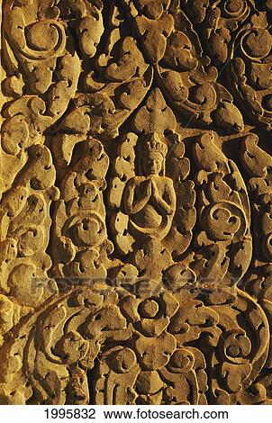 Stock Image - Cambodia, Angkor Wat, Close-Up Of Stone Carvings On Temple Wall.. Fotosearch