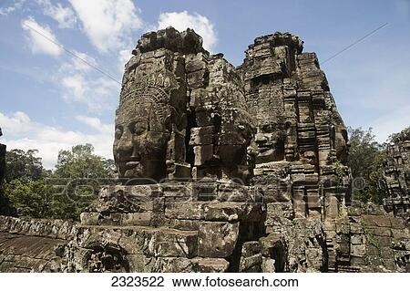 Stock Image - Cambodia, Giant stone heads at Bayon Temple; Angkor Wat. Fotosearch