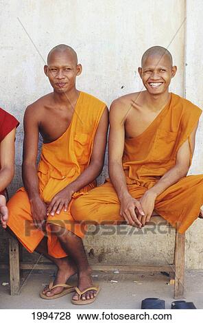 Cambodia, Phnom Phen Two Monks Sitting On Stone Bench. View Large Photo Image Stock Photo - Cambodia, Phnom Phen Two Monks Sitting On Stone Bench.. Fotosearch