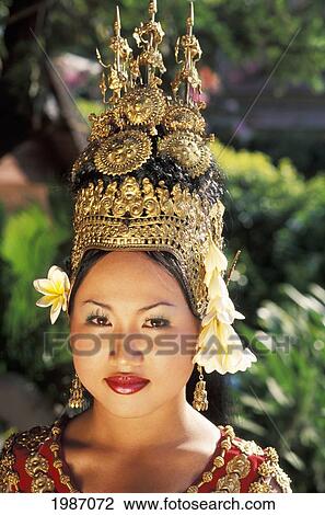Cambodia, Portrait of woman in traditional dancing costume with greenery in background; Siem Reap View Large Photo Image Stock Image - Cambodia, Portrait of woman in traditional dancing costume with greenery in background; Siem Reap. Fotosearch