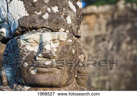 Cambodia, Siem Reap, Angkor Thom, Ancient, Weathered Statue Adorns South Gate. View Large Photo Image Stock Photo - Cambodia, Siem Reap, Angkor Thom, Ancient, Weathered Statue Adorns South Gate.. Fotosearch