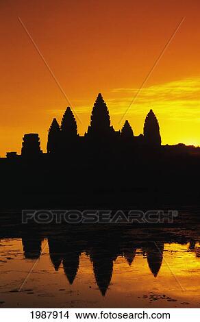 Picture - Cambodia, Siem Reap, Angkor Wat, Silhouette Of Temple At Sunrise, Reflections On Water Surface, Ornage Sky. Fotosearch