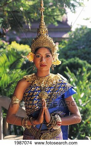 Cambodia, Siem Reap, Woman In Traditional Dancing Costume, Greenery In Background. View Large Photo Image Picture - Cambodia, Siem Reap, Woman In Traditional Dancing Costume, Greenery In Background.. Fotosearch