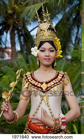 Stock Image - Cambodia, Siem Reap, Young Woman Wearing Traditional Dancer Attire.. Fotosearch