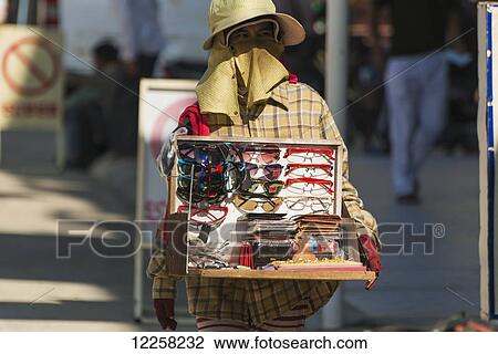 Cambodian girl selling sunglasses around the Old Market; Battambang, Cambodia View Large Photo Image Stock Image - Cambodian girl selling sunglasses around the Old Market; Battambang, Cambodia. Fotosearch