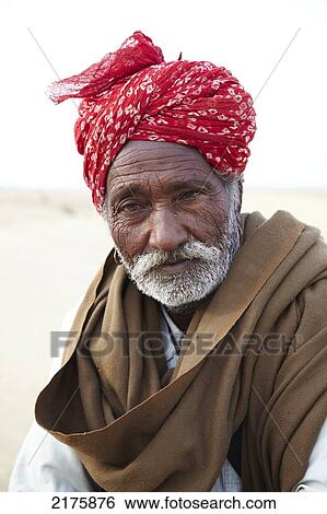 Stock Photograph - Camel Guide in The Thar Dessert Near Jaisalmer Rajasthan India. Fotosearch