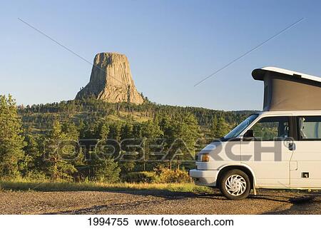 Stock Photography - Camper Van At Devils Tower National Monument; Wyoming United States Of America. Fotosearch