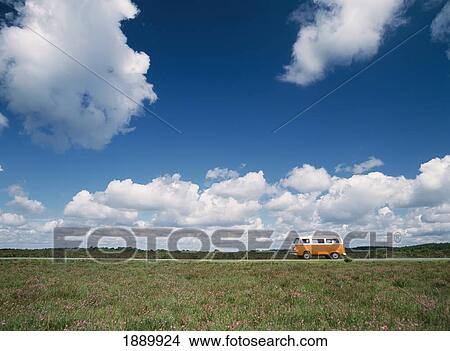 Campervan Going Down Road In Front Of Heather In Flower View Large Photo Image Picture - Campervan Going Down Road In Front Of Heather In Flower. Fotosearch