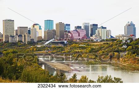 Picture - Canada, Alberta, Edmonton, Edmonton skyline across North Saskatchewan river facing West. Fotosearch