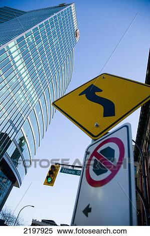 Stock Photography - Canada, British Columbia, Downtown; Vancouver, and street signs, High rise buildings. Fotosearch
