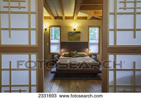 Canada, British Columbia, Japanese inspired master bedroom in eco friendly cottage; Vancouver Island View Large Photo Image Stock Image - Canada, British Columbia, Japanese inspired master bedroom in eco friendly cottage; Vancouver Island. Fotosearch