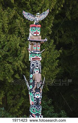 Canada, British Columbia, Vancouver, Stanley Park, First Nations Totem Pole Called Ga'akstalas - Of The Kwakwaka'wakw Culture, Carved By Wayne Alfred And Beau Dick / Design By Russel Smith. Editorial Use Only. View Large Photo Image Stock Image - Canada, British Columbia, Vancouver, Stanley Park, First Nations Totem Pole Called Ga'akstalas - Of The Kwakwaka'wakw Culture, Carved By Wayne Alfred And Beau Dick / Design By Russel Smith. Editorial Use Only.. Fotosearch