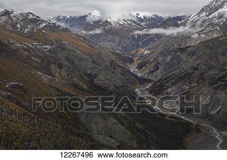 Stock Photograph - Canada Creek and the mountains surrounding it in Kluane National Park and Reserve; Yukon, Canada. Fotosearch