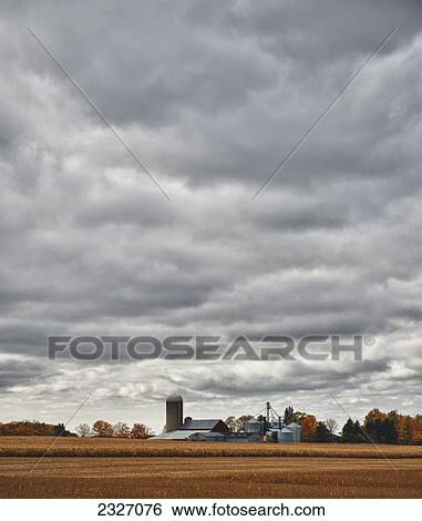 Canada, near London; Ontario, Farmland and farm structures under cloudy sky View Large Photo Image Stock Photograph - Canada, near London; Ontario, Farmland and farm structures under cloudy sky. Fotosearch