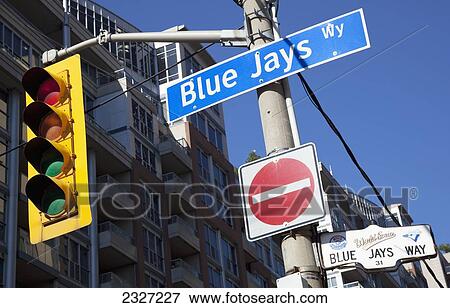 Stock Photo - Canada, Ontario, Street sign and traffic signal on Blue Jays Way in Downtown; Toronto. Fotosearch