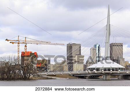 Canadian Museum For Human Rights Under Construction, Esplanade Riel Bridge And Downtown Winnipeg Skyline, Manitoba View Large Photo Image Picture - Canadian Museum For Human Rights Under Construction, Esplanade Riel Bridge And Downtown Winnipeg Skyline, Manitoba. Fotosearch