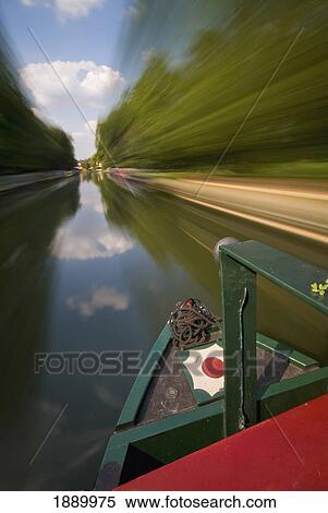 Stock Photography - Canal Boat Going Down The Grand Union Canal, Blurred Motion. Fotosearch
