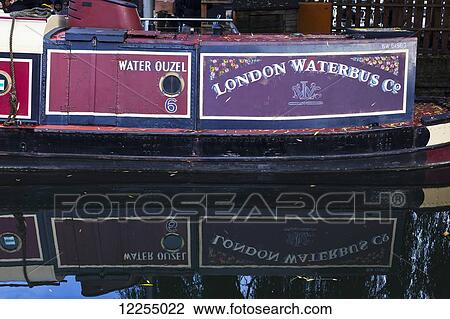 Stock Image - Canal boat moored at Camden Lock; London, England. Fotosearch
