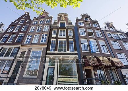 Canal Houses By The Amstel River, Amsterdam, Netherlands View Large Photo Image Stock Photo - Canal Houses By The Amstel River, Amsterdam, Netherlands. Fotosearch