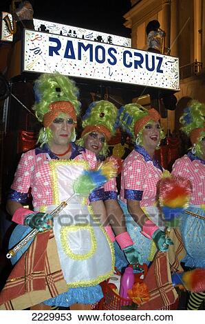 Stock Image - Canary Islands, Santa Cruz De Tenerife: Dancers In Drag Costumes Processing Through The Streets At The City's Annual Carnival. Copyright Anna Watson/Axiom.. Fotosearch