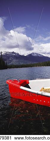 Stock Image - Canoe On Lake Beauvert. Fotosearch