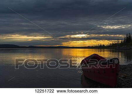 Canoe on the Yukon River at sunset; Yukon-Koyukuk, Alaska, United States of America View Large Photo Image Stock Image - Canoe on the Yukon River at sunset; Yukon-Koyukuk, Alaska, United States of America. Fotosearch