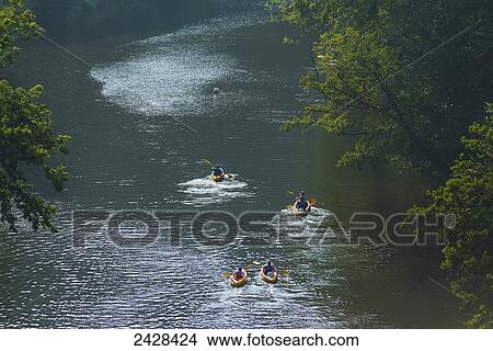 Picture - Canoeists paddling along L'Orne River; Clecy, Swiss Normandy, Normandy, France. Fotosearch