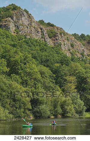 Stock Photo - Canoeists paddling along L'Orne River; Clecy, Swiss Normandy, Normandy, France. Fotosearch