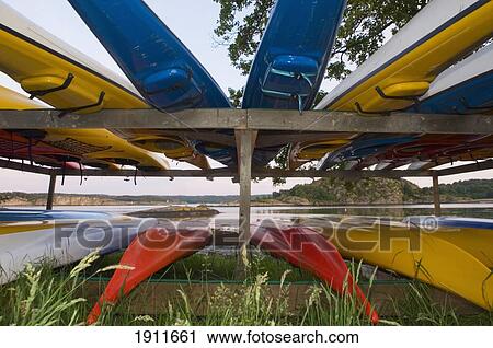 Stock Image - Canoes On Rack, Flaton Island, Bohuslan Coast, Sweden. Fotosearch