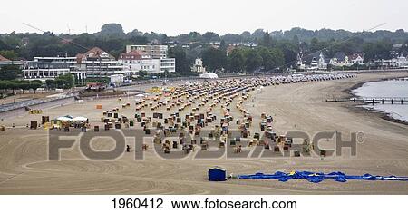 Canopied Wicker Chairs On Travemunde Beach; Lubeck, Germany View Large Photo Image Stock Image - Canopied Wicker Chairs On Travemunde Beach; Lubeck, Germany. Fotosearch
