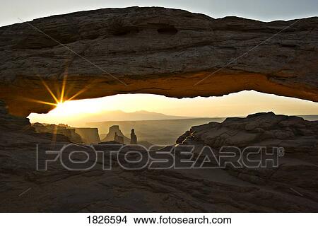 Picture - Canyonlands National Park, Utah, Usa; Sunset Through Arch Of Rock Formation. Fotosearch