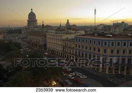 Capitolio Nacional, Hotels Inglaterra And Telegrafo, Cars On Paseo Del Prado, And Parque Central From Roof Of Hotel Parque Central At Dusk; Havana, Artemisa, Cuba View Large Photo Image Stock Photo - Capitolio Nacional, Hotels Inglaterra And Telegrafo, Cars On Paseo Del Prado, And Parque Central From Roof Of Hotel Parque Central At Dusk; Havana, Artemisa, Cuba. Fotosearch