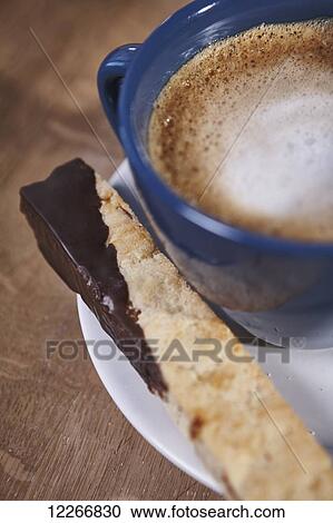 Cappuccino and chocolate dipped biscotti on a white plate; Ontario, Canada View Large Photo Image Stock Image - Cappuccino and chocolate dipped biscotti on a white plate; Ontario, Canada. Fotosearch