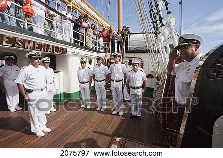 Stock Photo - Captain Humberto Ramirez Welcomes Rear Admiral Oscar Cristian Millar On Board The Four-Mast Barquentine, Chilean Navy Training Ship Esmeralda In Hanga Roa Harbour, Rapa Nui (Easter Island), Chile. Fotosearch