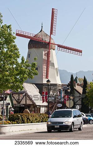 Stock Photo - Car Passing Windmill; California, Usa. Fotosearch