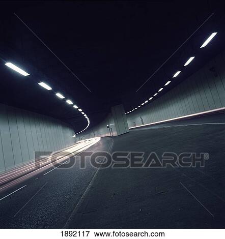 Stock Photo - Car Tail Lights Through Tunnel. Fotosearch