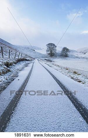 Stock Image - Car Tracks In Fresh Snow. Fotosearch