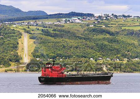 Stock Photograph - Cargo Boat On The St. Lawrence River, Saint-Joseph-De-La-Rive And Les Eboulements Village, Charlevoix Region, Quebec. Fotosearch