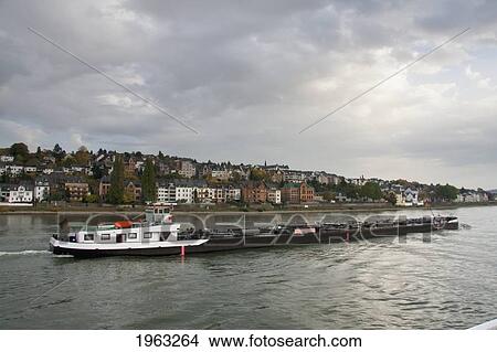 Picture - Cargo Ship On The Rhine River By Ehrenbreitstein, Rhineland-Palatinate, Germany. Fotosearch