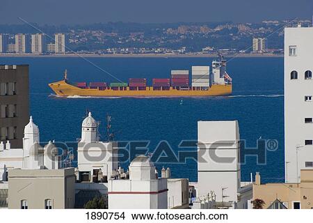 Cargo Ship Passing City Skyline View Large Photo Image Picture - Cargo Ship Passing City Skyline. Fotosearch