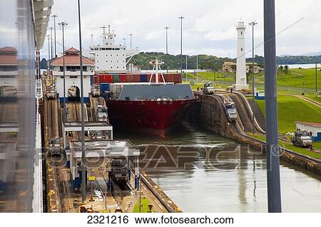 Stock Photograph - Cargo ship transitioning between Gatun Locks; Panama Canal, Panama. Fotosearch